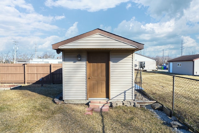 view of shed with a fenced backyard