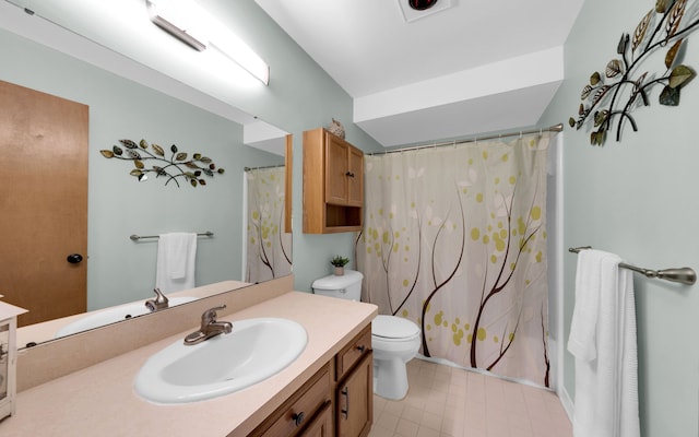 bathroom with toilet, curtained shower, and vanity