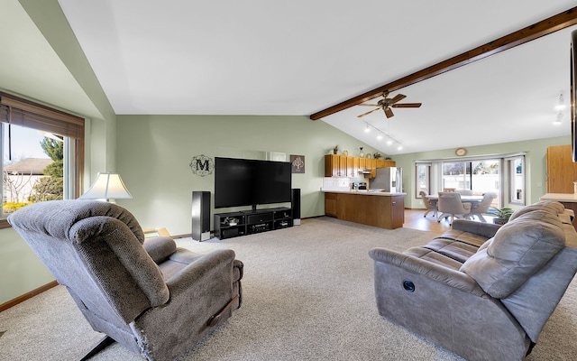 living area with vaulted ceiling with beams, a ceiling fan, baseboards, and light carpet