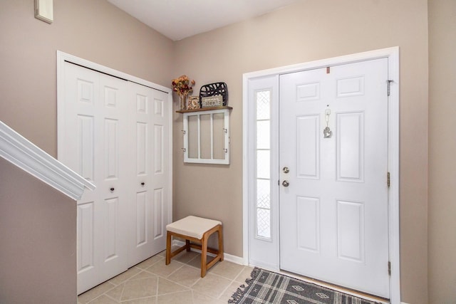 foyer with light tile patterned flooring