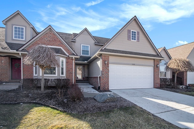 view of front of home with a garage, brick siding, roof with shingles, and driveway