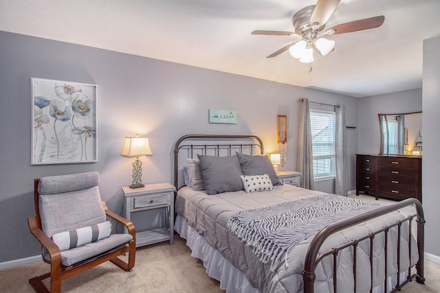 bedroom featuring baseboards, carpet floors, and ceiling fan