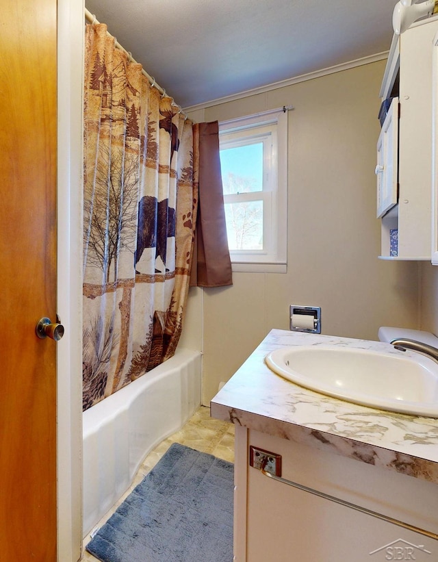 bathroom featuring vanity and shower / bath combo