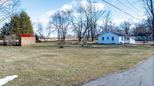 view of yard with a shed and an outdoor structure