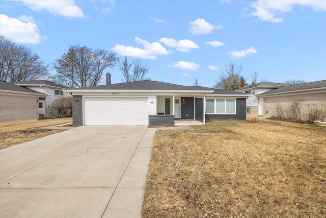 ranch-style house with driveway, an attached garage, a chimney, a front lawn, and brick siding