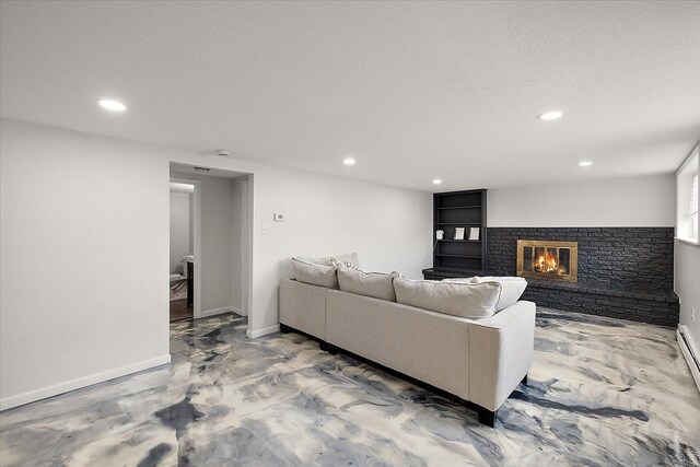 living room featuring recessed lighting, baseboards, a textured ceiling, and a brick fireplace