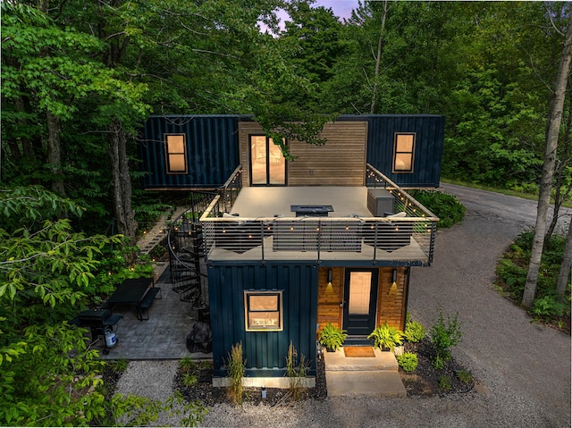 view of front of home featuring stairway and board and batten siding