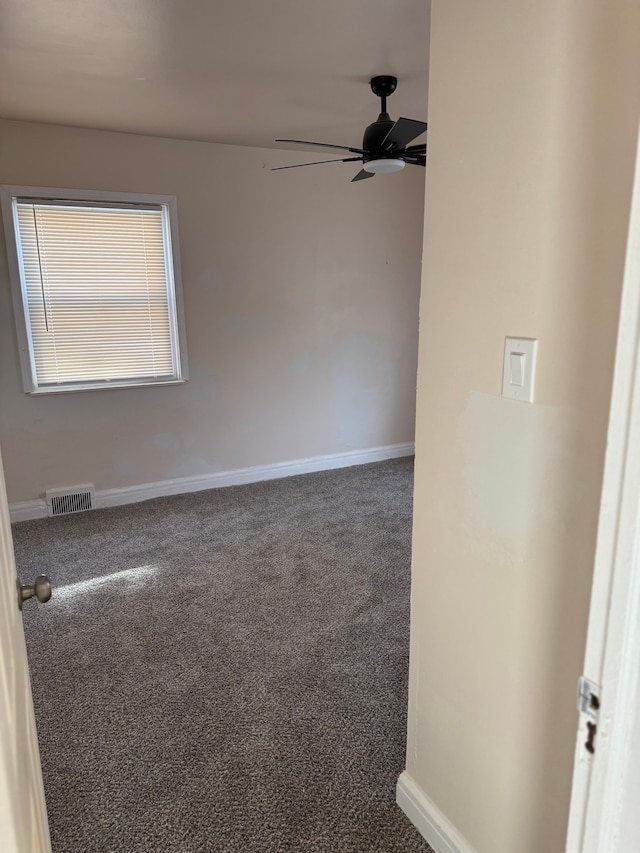 5066 Bedford St, Detroit, MI 48224 - unfurnished room with visible vents, baseboards, carpet flooring, and a ceiling fan