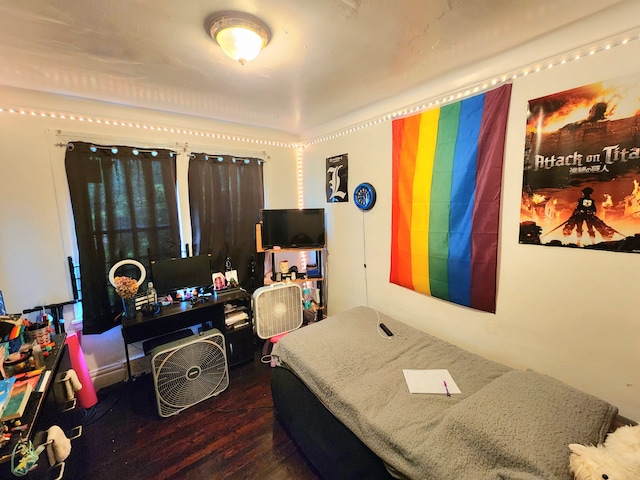 bedroom featuring wood finished floors