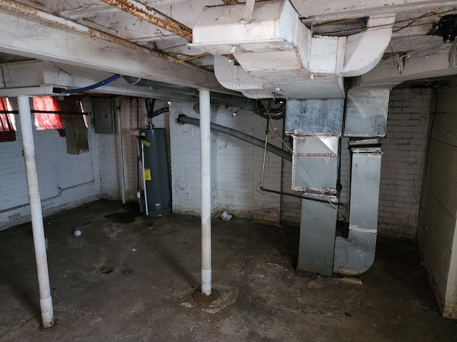 unfinished basement with electric panel and gas water heater