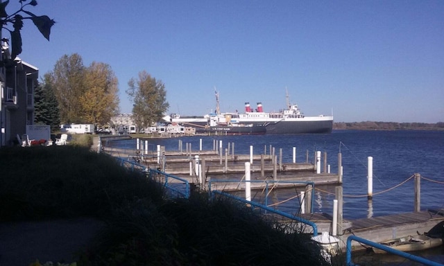 dock area featuring a water view