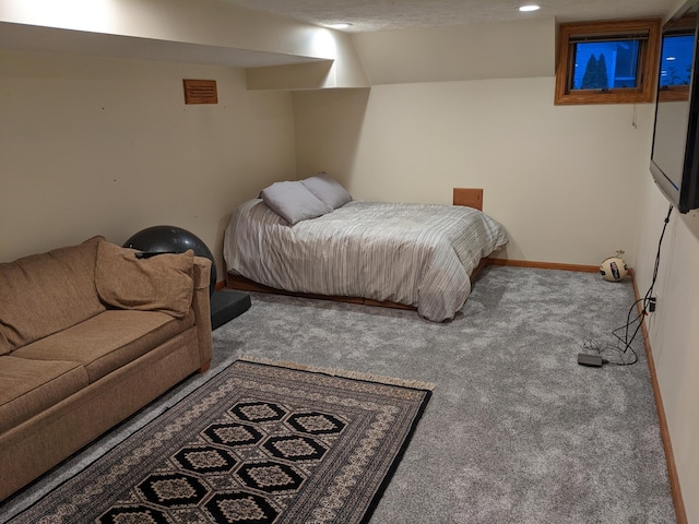 carpeted bedroom featuring baseboards