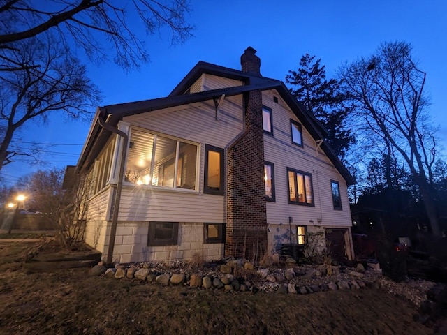 view of home's exterior featuring a chimney