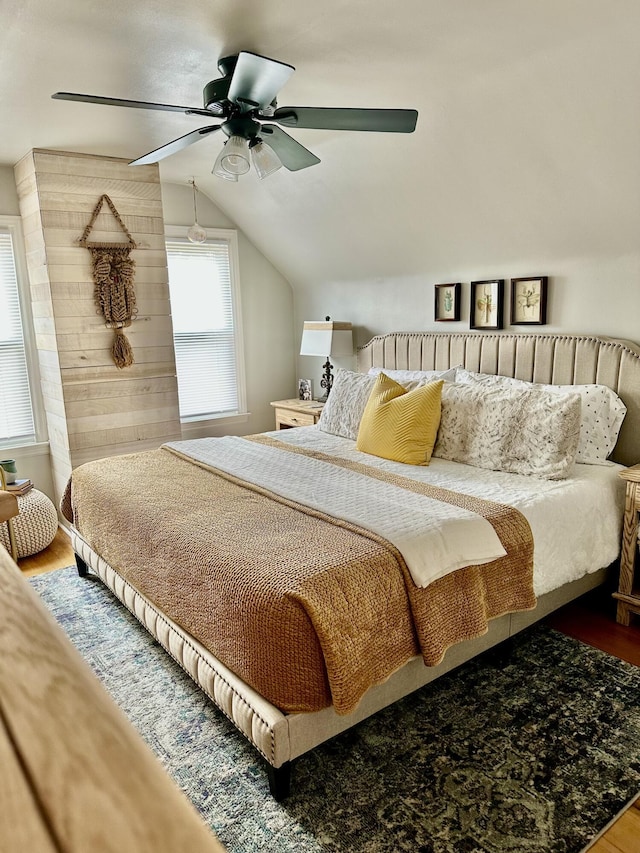 bedroom featuring ceiling fan, lofted ceiling, and wood finished floors