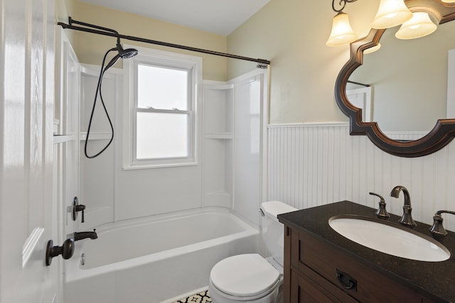 full bath featuring a wainscoted wall, toilet, tub / shower combination, and vanity