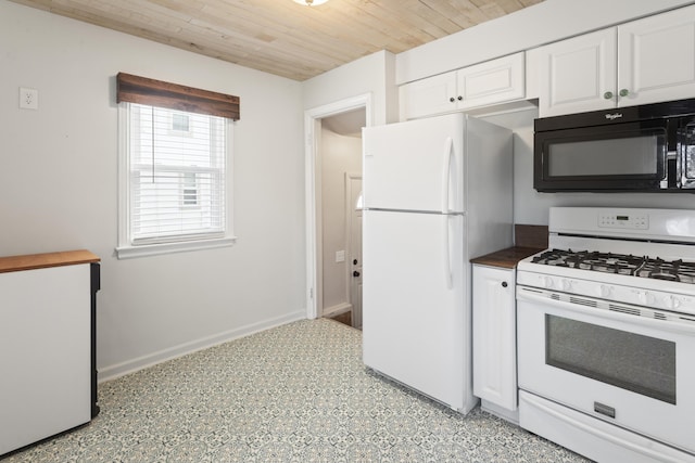 kitchen featuring white appliances, baseboards, white cabinets, dark countertops, and wooden ceiling