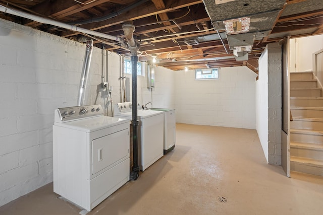 basement featuring stairs and washing machine and dryer