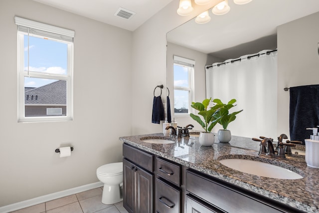 full bath featuring tile patterned floors, toilet, visible vents, and a sink