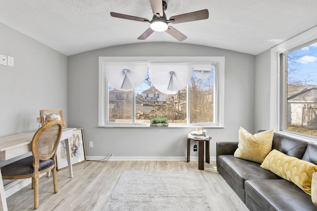 office area with baseboards, lofted ceiling, and wood finished floors