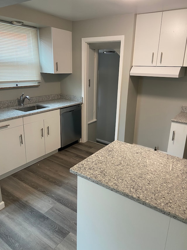 kitchen featuring light stone counters, a sink, dark wood-type flooring, white cabinets, and dishwasher