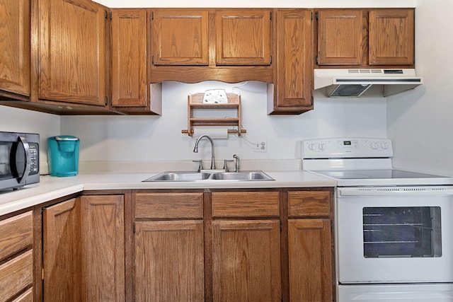 kitchen featuring black microwave, white range with electric cooktop, under cabinet range hood, light countertops, and a sink