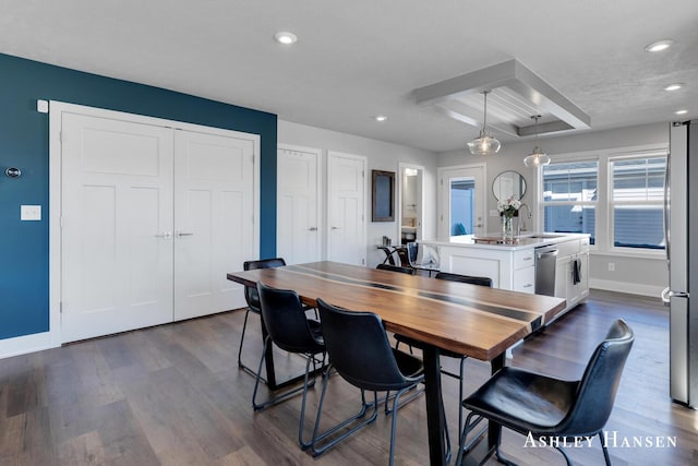 dining space with recessed lighting, baseboards, and dark wood-type flooring