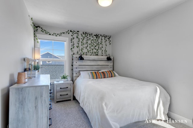 bedroom with light carpet