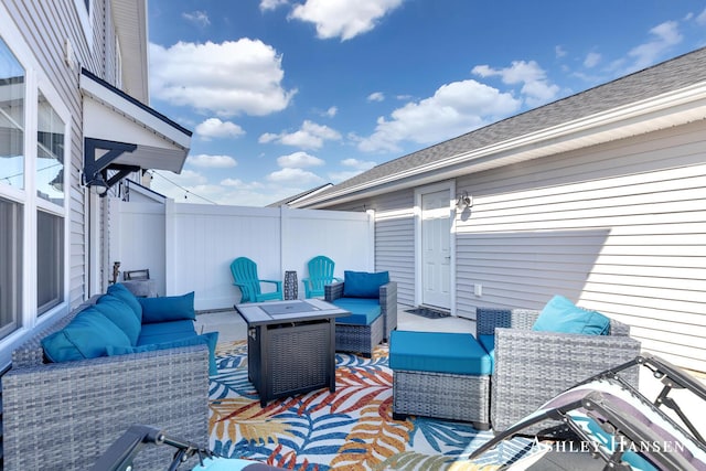 view of patio / terrace featuring an outdoor living space and fence