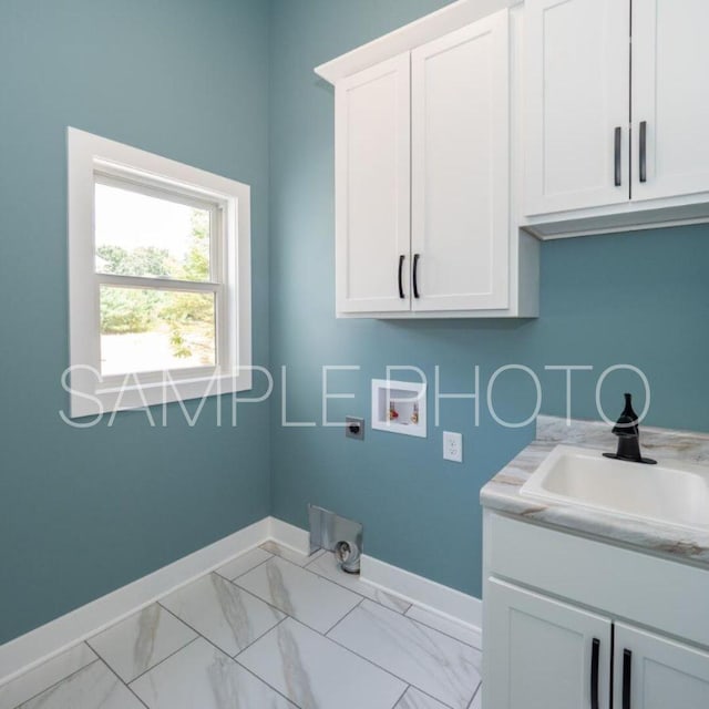 washroom featuring baseboards, cabinet space, a sink, washer hookup, and marble finish floor