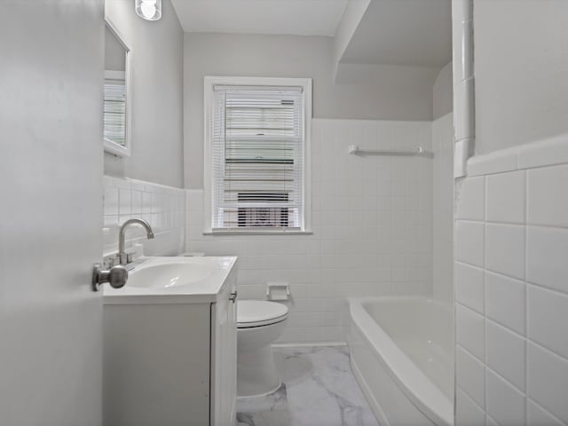 full bathroom featuring plenty of natural light, marble finish floor, toilet, and tile walls