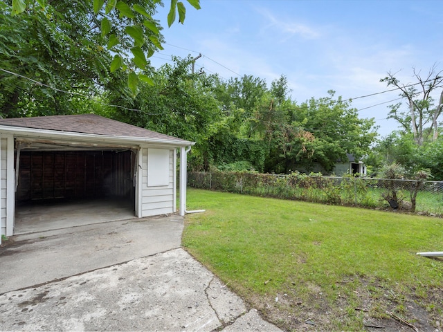 view of yard featuring an outdoor structure and fence