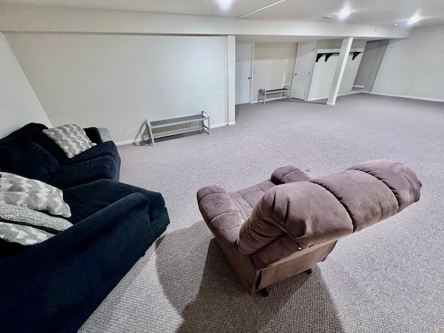 living room featuring carpet and baseboards