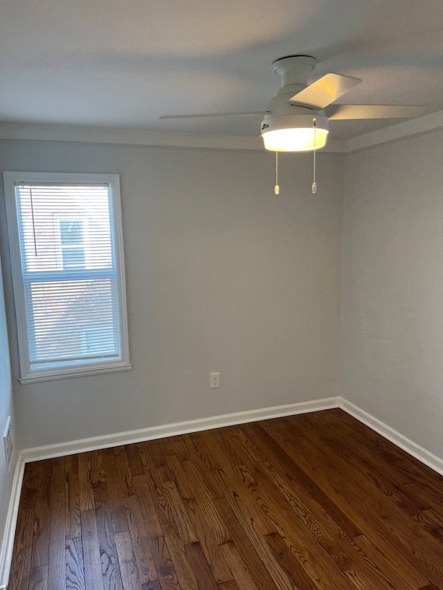 spare room with ceiling fan, baseboards, and hardwood / wood-style floors