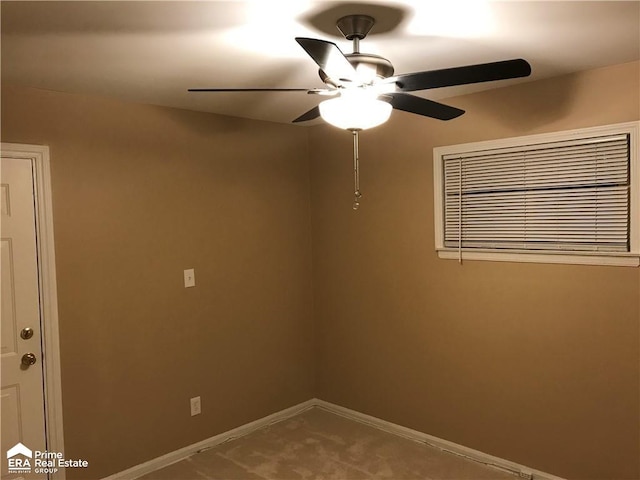 empty room with baseboards and ceiling fan