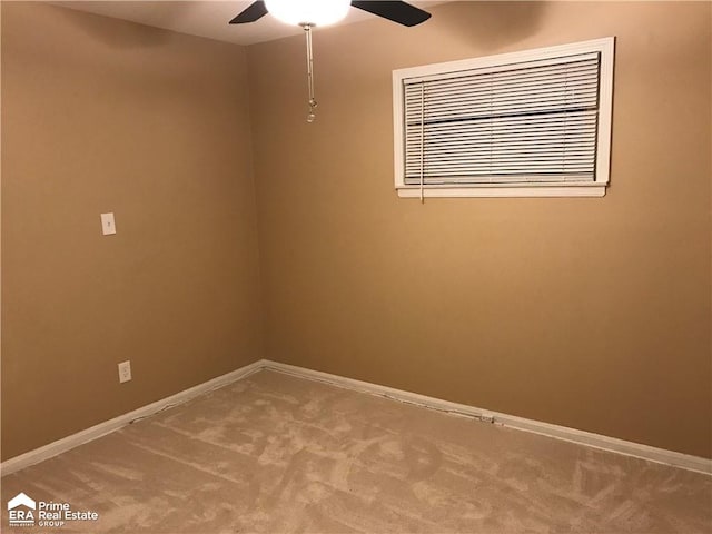 carpeted empty room with baseboards and ceiling fan