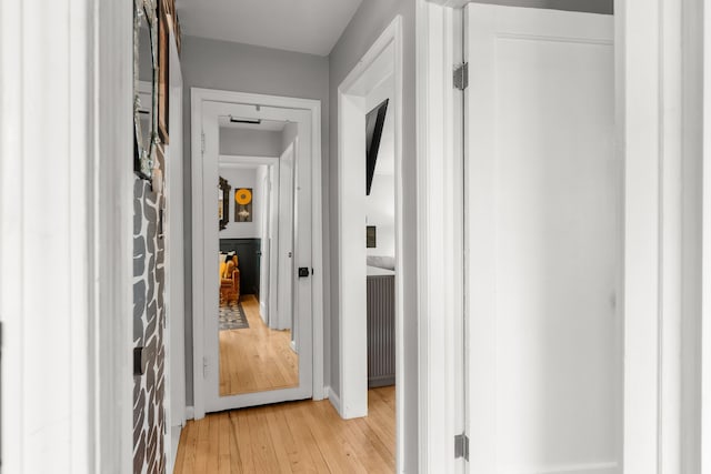 corridor with light wood-style floors