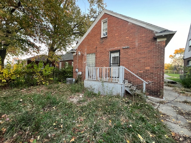 rear view of house with brick siding