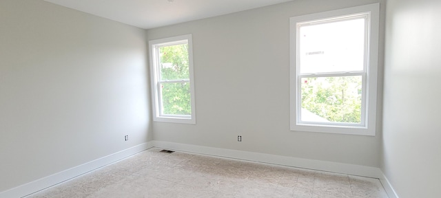 1442 Kimber Dr Unit 120, Lowell, MI 49331 - spare room with baseboards
