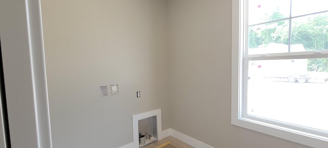 1442 Kimber Dr Unit 120, Lowell, MI 49331 - laundry room featuring baseboards