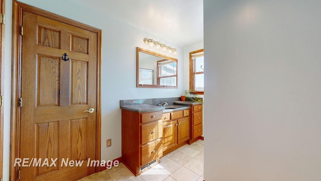 bathroom featuring tile patterned floors and vanity