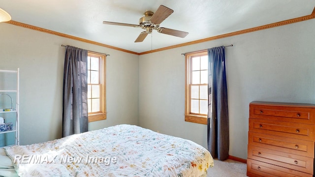 bedroom with a ceiling fan, light colored carpet, and ornamental molding