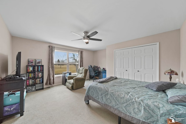 bedroom with a ceiling fan, carpet, and a closet