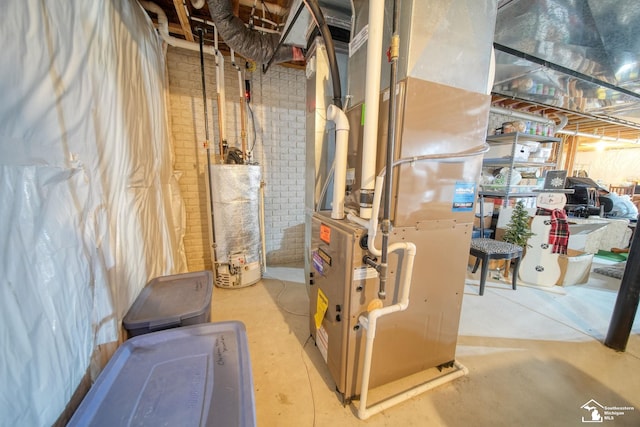 utility room with heating unit and gas water heater