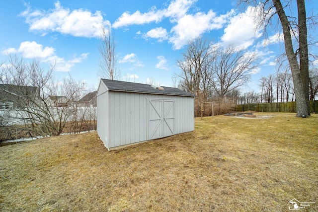 view of shed with a fire pit