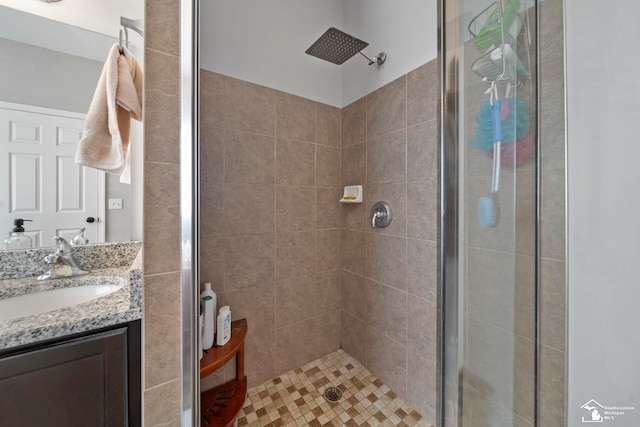 bathroom featuring a stall shower and vanity