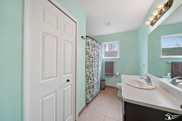 full bath featuring vanity, visible vents, baseboards, tile patterned flooring, and toilet