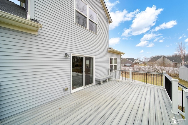 wooden deck with a residential view