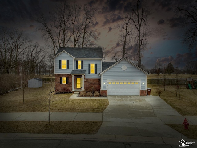 view of front of home featuring a storage unit, a front lawn, driveway, a garage, and brick siding