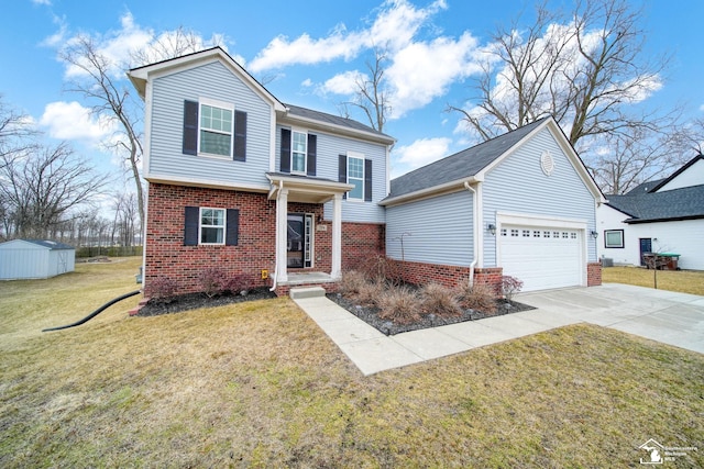 traditional-style house with brick siding, a front lawn, concrete driveway, an outdoor structure, and an attached garage