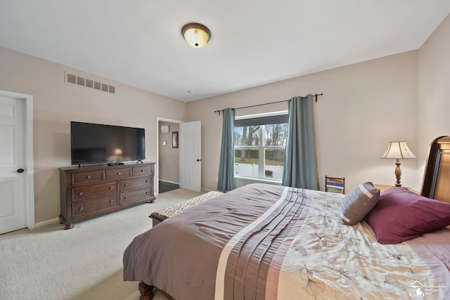 bedroom with light carpet, visible vents, and baseboards